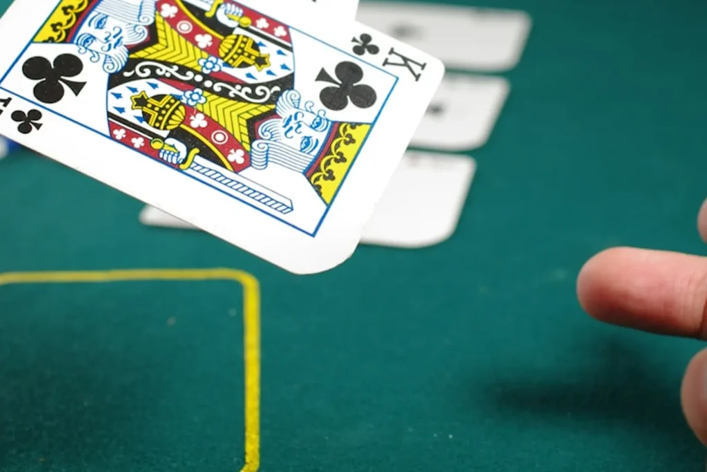 King of clubs in the air